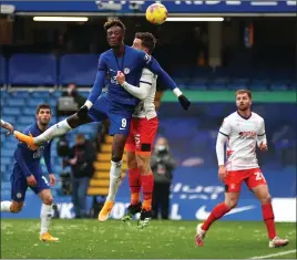  ??  ?? Tammy Abraham rises highest to head home Chelsea’s second