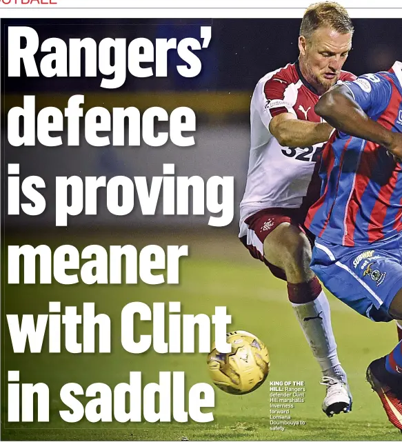  ??  ?? KING OF THE
HILL: Rangers defender Clint Hill marshalls Inverness forward Lonsana Doumbouya to safety