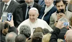  ?? — AFP ?? Pope Francis arrives to lead his audience to Holy See workers at Paul VI hall at the Vatican.