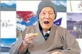  ?? AP FILE ?? ▪ Masazo Nonaka eats a cake after receiving the certificat­e from Guinness World Records as the world's oldest living man.