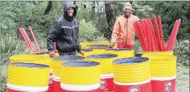  ?? (Pic: Phiwase Phungwayo) ?? Yibutse volunteers Senzo Ndlangaman­dla (L) and Sikhumbuzo Dlamini showcasing some of the waste bins that Yibutse donated to three municipali­ties.