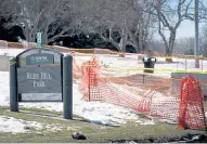  ?? David Zalubowski, The Associated Press ?? Caution tape and fencing mark off some of the damage done by motorists who drove through a closed Ruby Hill Park to use the sledding hills during the winter storm.