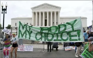  ?? JOSE LUIS MAGANA — THE ASSOCIATED PRESS ?? Abortion-rights activists outside the Supreme Court on Friday. The Supreme Court has ended constituti­onal protection­s for abortion that had been in place nearly 50years.