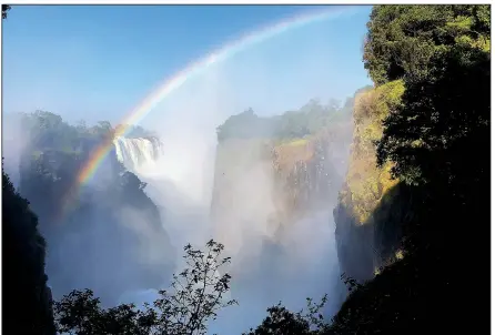 ??  ?? Intrepid Travel’s nine-day tour started on the Zimbabwe side of Victoria Falls, the largest waterfall in the world. Tourgoers could pay extra for such excursions as a helicopter ride or a gorge swing.