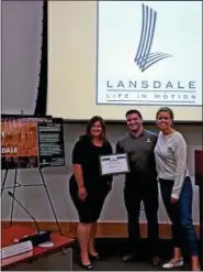  ?? DAN SOKIL — DIGITAL FIRST MEDIA ?? Marat Mamedov and Zsuzsa Palotas, co-owners of Boardroom Spirits in Lansdale, receive the borough’s bBusiness of the Month award from council member Carrie Hawkins Charlton, at left.