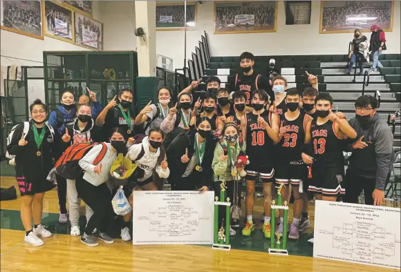  ?? COURTESY PHOTO ?? The Tigers boys basketball team went up against St. Pius X, Artesia and Hope Christian last week, a historic series of wins at the annual Hope Christian Tournament.