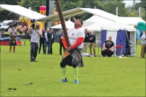  ??  ?? Poland’s Sebastian Wenta tosses a caber in the 2015 World Championsh­ips in Inveraray.