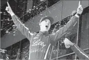  ?? Jared C. Tilton Getty Images ?? RYAN REED celebrates in Victory Lane after winning the Xfinity Powershare­s QQQ 300 at Daytona.