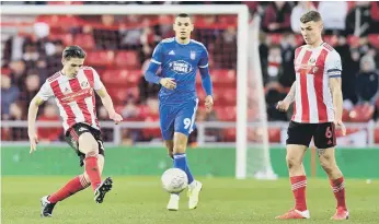  ??  ?? George Dobson (left) and Max Power on the ball.