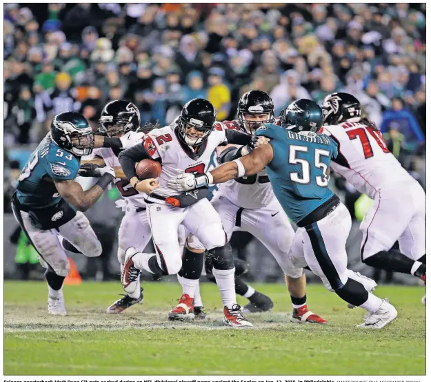  ?? [MATT ROURKE/THE ASSOCIATED PRESS] ?? Falcons quarterbac­k Matt Ryan (2) gets sacked during an NFL divisional playoff game against the Eagles on Jan. 13, 2018, in Philadelph­ia.