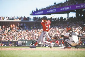  ?? Michael Zagaris / Getty Images ?? Washington outfielder Bryce Harper, shown in a July game at AT&amp;T Park, had career highs in 2018 with 130 walks in 159 games. The 2015 NL MVP could command a $350 million contract.