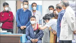 ??  ?? A medic administer­s India’s first Covid vaccine to Manish Kumar, a frontline worker from Delhi at AIIMS on Saturday. PHOTO PTI