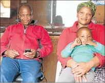  ??  ?? CUT ABOVE: Themba Ndyebi and his wife Bongiwe at their barber shop and sewing business. With them is their two-year-old son, Linanamand­la