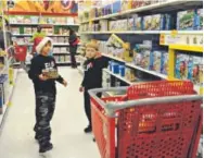  ?? Anya Semenoff, Denver Post file ?? Jack Mandeville and Jared Engerman, left, shop at a Target store in Highlands Ranch in 2013.