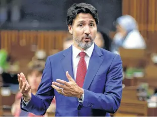  ?? REUTERS ?? Canada’s Prime Minister Justin Trudeau, seen here speaking in the House of Commons on Oct. 21, said Monday it would be “premature” to set a new fiscal anchor in Ottawa’s upcoming fall economic update.