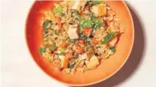  ??  ?? Brown Rice Salad With Carrots, Scallions and Baked Tofu.