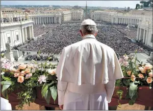  ?? AP ?? Pope Francis addresses the crowd before delivering his Easter message from the main balcony of St. Peter’s Basilica at the Vatican on Sunday.