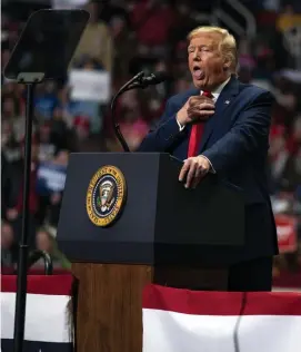  ??  ?? BACK AT IT: President Trump makes a joke as he speaks during a campaign rally Monday at Bojangles Coliseum in Charlotte, N.C.