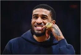  ?? JOSE CARLOS FAJARDO — BAY AREA NEWS GROUP ?? Gary Payton II shows off his 2022NBA Championsh­ip ring during a pre-game ceremony before a game at the Chase Center in San Francisco on Dec. 30.