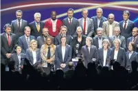  ?? CHRISTOPHE ENA THE ASSOCIATED PRESS ?? Canada’s coach Kenneth Heiner-Moller, top row, fourth from the right, takes part in the Women’s World Cup draw on Saturday.