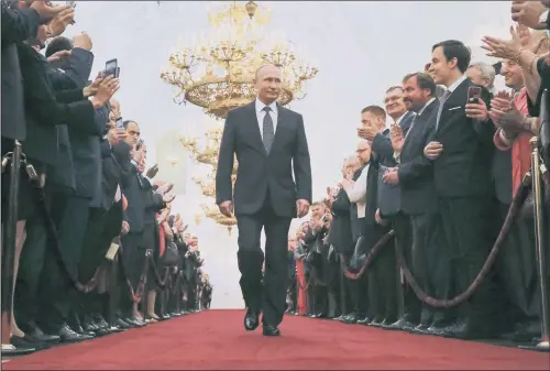  ??  ?? Vladimir Putin enters to take the oath during his inaugurati­on ceremony as Russia’s new president in the Grand Kremlin Palace in Moscow.