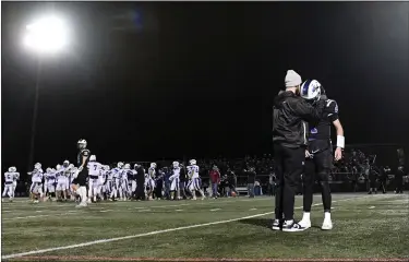  ?? BILL UHRICH — READING EAGLE ?? Quarterbac­k Mason Rotelli is consoled following the Eagles’ loss in the District 3Class 5A final Friday at Don Thomas Stadium.