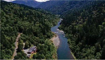  ?? AFP PIC ?? The Klamath River flowing by the Yurok tribe tribal headquarte­rs in California on Wednesday. Green, the colour of nature, gives us peace and inspiratio­n.