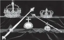  ??  ?? Thieves snatched two gold crowns and an orb from a display at an exhibition in a small town’s cathedral in Sweden.