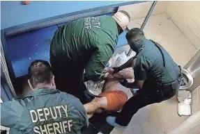  ?? PROVIDED BY HERNANDO COUNTY SHERIFF’S OFFICE ?? On April 15, 2022, Tim Peters was in distress as he argued with staff at the Hernando County Jail north of Tampa, Fla. Deputies pepper-sprayed him and covered his head with a mesh hood to prevent him from spitting on them.