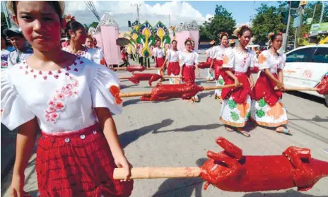  ??  ?? GRANDER THIS YEAR. Talisay City promises a bigger Halad Inasal Festival this year, integratin­g the Department of Tourism’s “It’s More Fun in the Philippine­s” slogan.