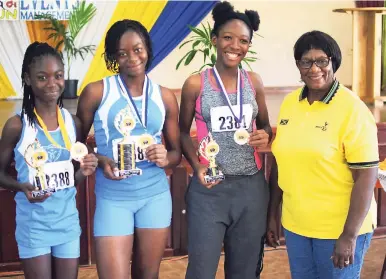  ??  ?? Akelia Hamilton (second left), a student at St Catherine High School, took the female section of the Mayor George Lee Foundation 6Km road race in 26 minutes, 24 seconds, while her teammate Serena Douglas (left) (26:40), and Dana Thomas (27:59) of...