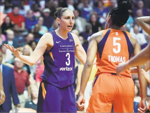  ?? Sean D. Elliot / Associated Press ?? Connecticu­t Sun guard Jasmine Thomas (5) confronts Phoenix Mercury guard Diana Taurasi after being fouled during the first half of a singleelim­ination WNBA basketball playoff game Aug. 23, 2018, at Mohegan Sun Arena.