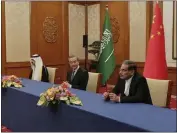  ?? NOURNEWS VIA AP ?? Secretary of Iran's Supreme National Security Council
Ali Shamkhani, right, China's most senior diplomat Wang Yi, center, and Saudi Arabia's National Security Adviser Musaad bin Mohammed al-Aiban look on in Beijing, China, on March 10 during an agreement signing ceremony between Iran and Saudi Arabia to reestablis­h diplomatic relations and reopen embassies after seven years of tensions between the Mideast rivals.