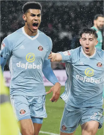  ??  ?? Ashley Fletcher enjoys his goal at Derby with team-mate Lynden Gooch. Pictures by Frank Reid.
