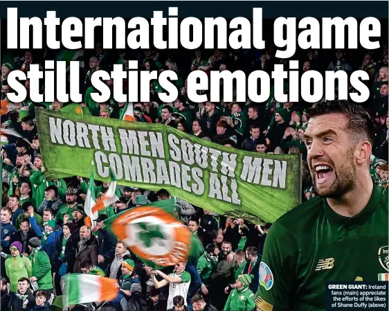  ??  ?? GREEN GIANT: Ireland fans (main) appreciate the efforts of the likes of Shane Duffy (above)