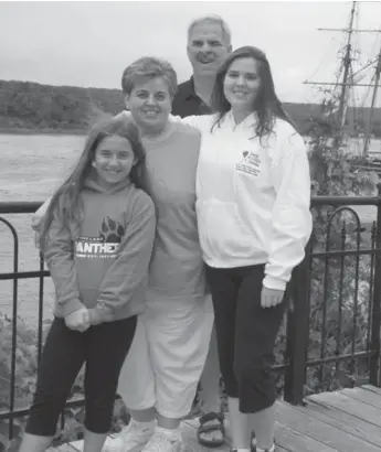  ??  ?? Laura Hillier, right, with parents Frances and Greg and sister Heather in 2013. Intensive chemo treatments brought Laura close to death at age 13, but also led to her remission. Just after her 18th birthday, her symptoms reappeared.