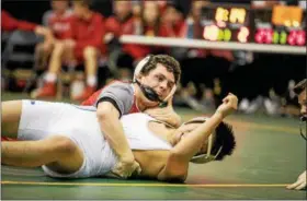  ?? NATE HECKENBERG­ER - FOR DIGITAL FIRST MEDIA ?? Cole Meredith of Owen J. Roberts collects near-fall points in a win at 145 pounds against Quakertown.