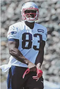  ?? STAFF PHOTO BY JOHN WILCOX ?? EXCITED TO BE HERE: Tight end Dwayne Allen hits the field for practice yesterday.