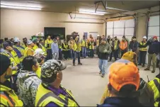  ?? NATHAN BURTON/Taos News ?? Mine workers gather at Granite Constructi­on in Questa every morning at 6:30 a.m. for a ‘safety standup’ meeting.