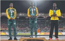  ?? Picture: AAP IMAGE ?? Henricho Bruintjies, Akani Simbine and Yohan Blake.