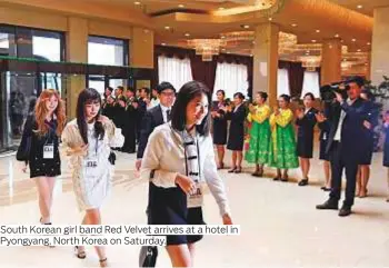  ?? Photos by AP, Reuters and instagram. com/ mandymoore­mm ?? South Korean girl band Red Velvet arrives at a hotel in Pyongyang, North Korea on Saturday.