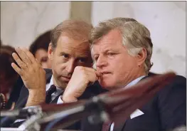  ?? JOHN DURICKA — THE ASSOCIATED PRESS FILE ?? Then-Senate Judiciary Chairman Joseph Biden Jr., of Delaware, left, speaks with Sen. Edward Kennedy, D-Mass., during the confirmati­on hearings for Supreme Court nominee Robert H. Bork on Capitol Hill in Washington.