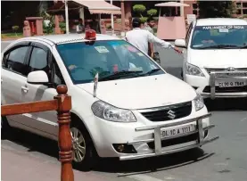  ??  ?? NEW DELHI: This file photo taken on May 8, 2015 shows an Indian politician’s car with a red beacon on it outside Parliament House. —AFP