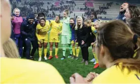  ?? Photograph: Jean Catuffe/Getty Images ?? Emma Hayes and her team celebrate victory over Paris Saint-Germain in last season’s Champions League quarter-finals.