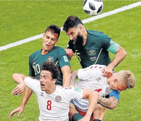  ?? Picture:AFP PHOTO / MANAN VATSYAYANA ?? CRUNCH TIME: Denmark defender Simon Kjaer, left, and Australia forward Andrew Nabbout go up for a header during the Russia 2018 World Cup Group C match at the Samara Arena in Samara yesterday