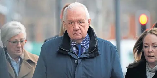  ??  ?? IN THE DOCK: Former police chief superinten­dent David Duckenfiel­d arrives at Preston Crown Court for the first day of his trial