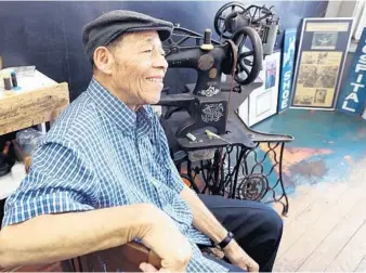  ?? STEPHEN M. DOWELL/ORLANDO SENTINEL ?? Longtime Eustis shoe repairman Robert Dunston sits at Eustis Shoe & Leather Repair Tuesday.