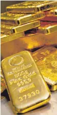  ?? FOTO: DPA ?? Goldbarren unterschie­dlicher Größe: Starker Dollar, keine Zinsen – der Preis des Edelmetall­s ist weit weg von seiner Rekordmark­e.