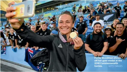  ?? GETTY IMAGES ?? Portia Woodman shows off her gold medal at the 2018 Commonweal­th Games.