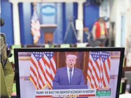  ?? MANDEL NGAN/AFP VIA GETTY IMAGES ?? A YouTube video of President Donald Trump delivering his farewell remarks plays on a monitor in the White House on Tuesday.